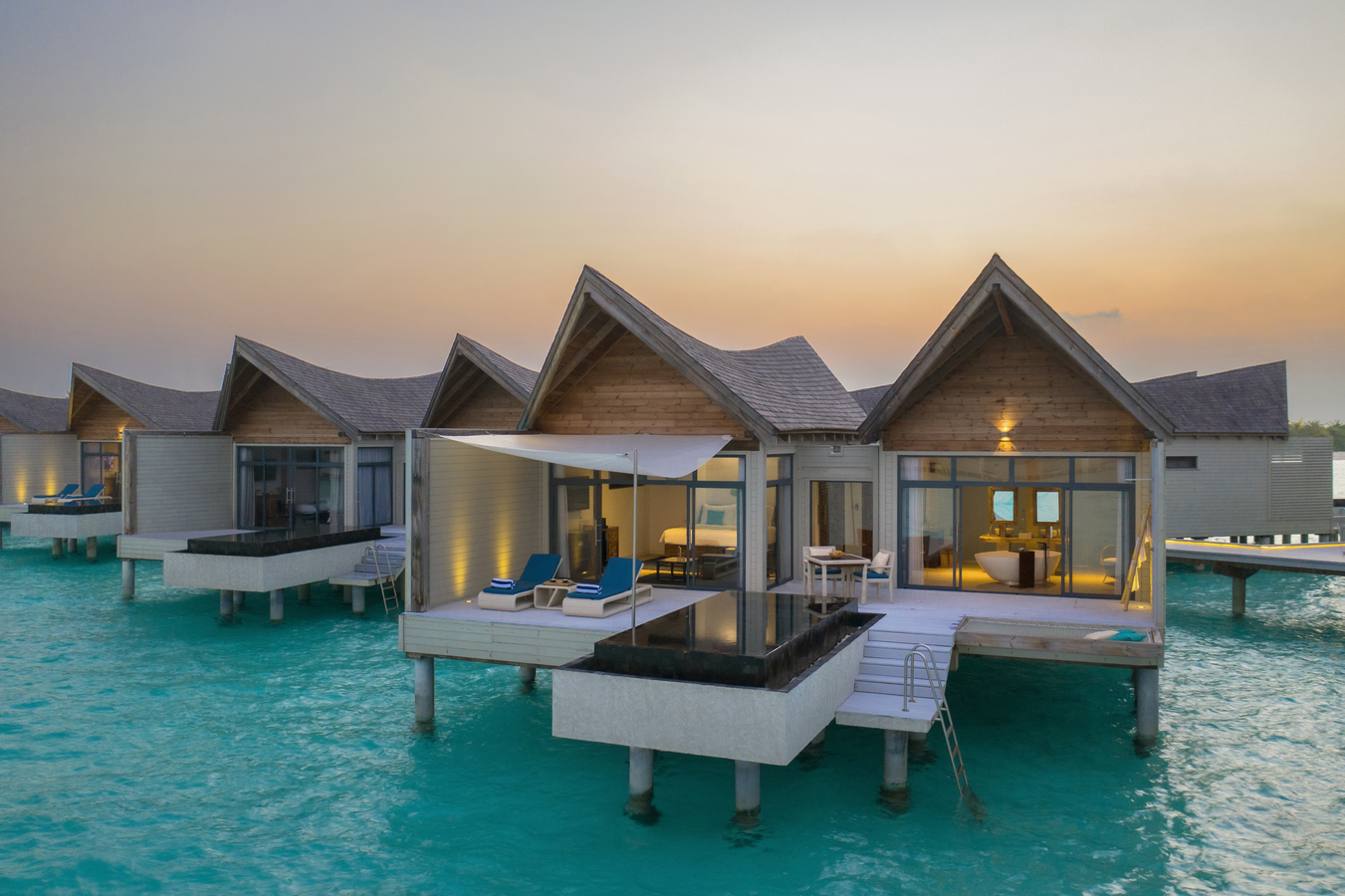 4. Kuredhivaru Resort and Spa - Overwater Pool Villa outdoor golden hour