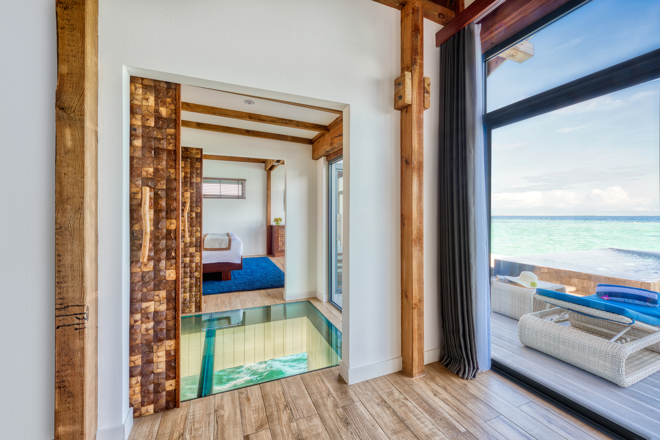 6. Kuredhivaru Resort and Spa - Overwater Pool Villa glass-bottom floor